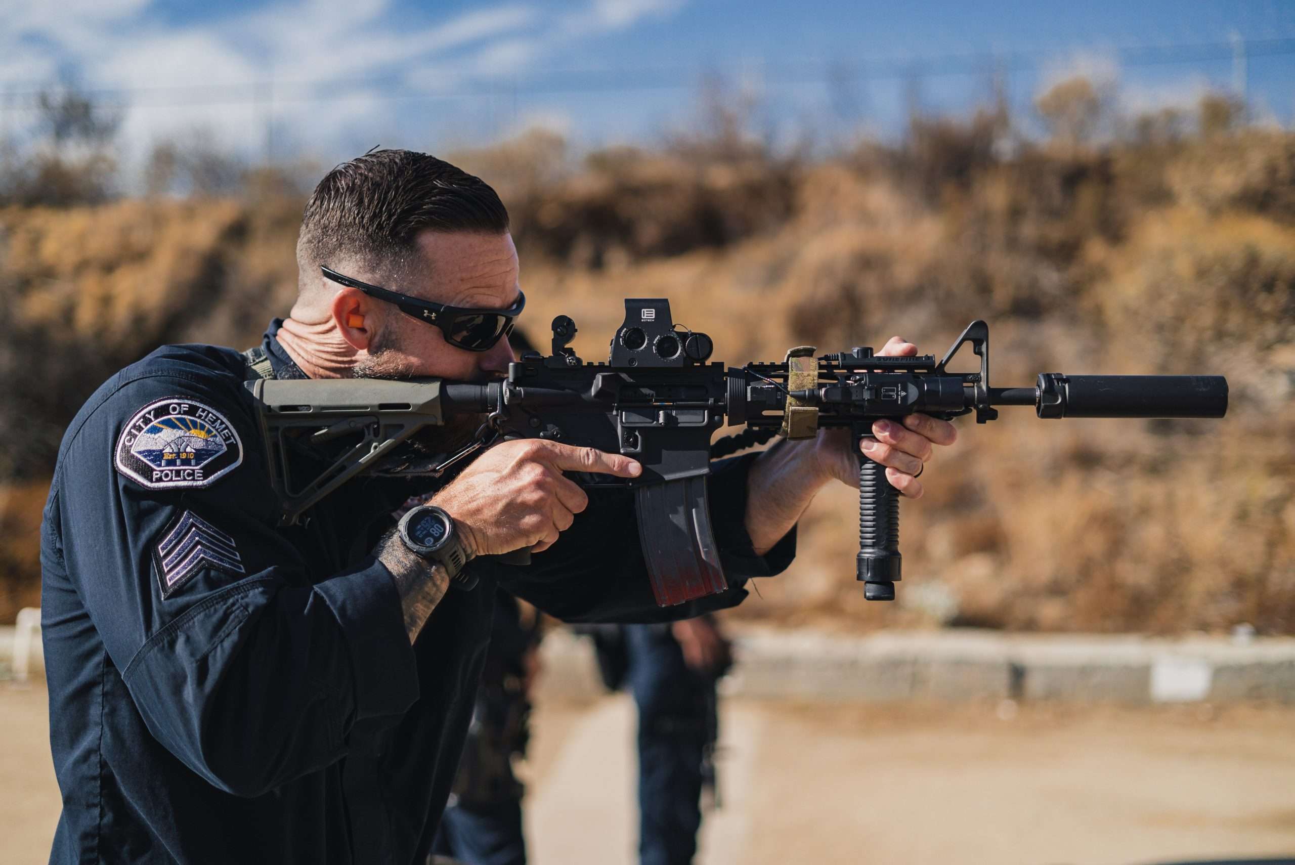 A Hemet Police SWAT Team member shoots his rifle on the firing range