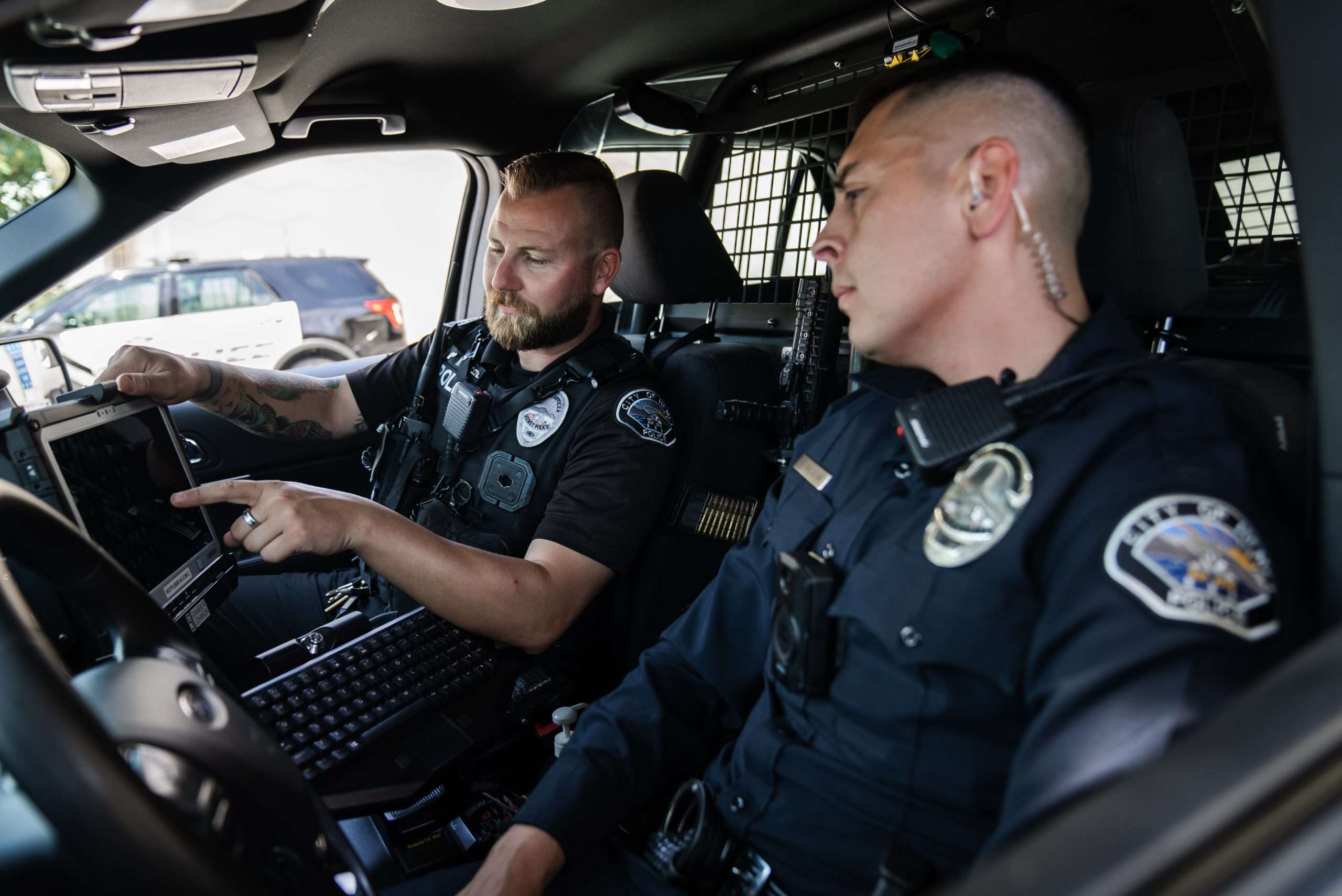 A Hemet Police Training Officer discusses a call with an officer