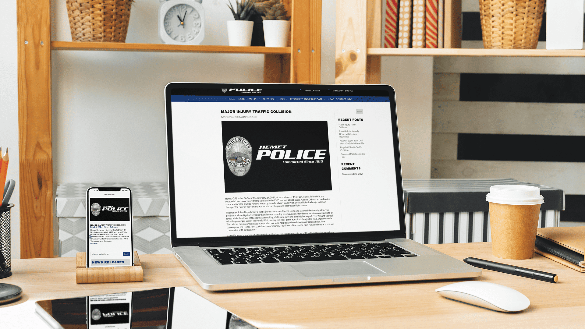 Law enforcement website on a laptop and mobile phone, on a desk